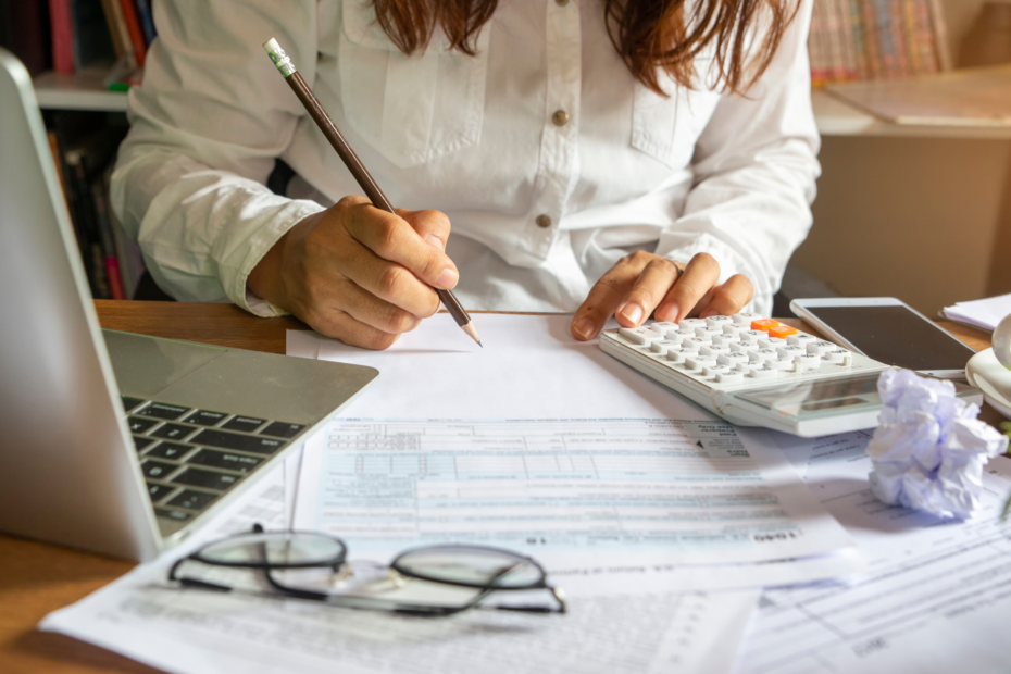 A woman at a desk planning and organizing at the office.
