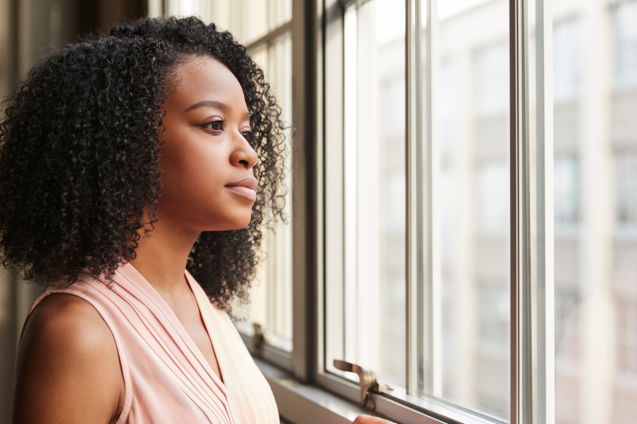 Business people focusing on the future by looking out a window of a modern office