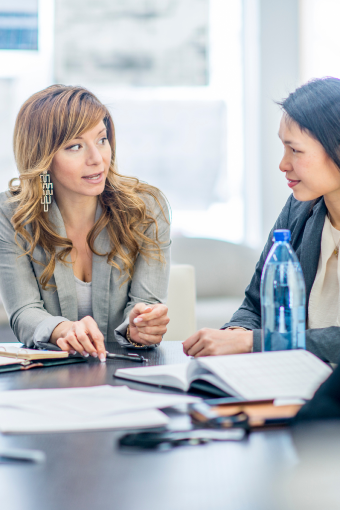 A female business owner or CEO taking charge of a meeting.