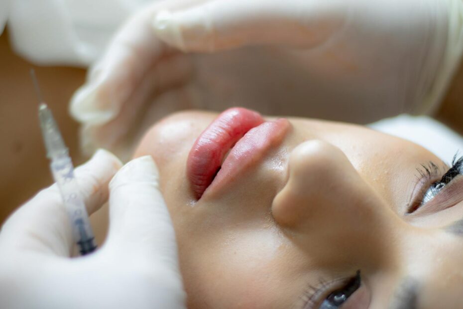 hands with syringe touching patient face